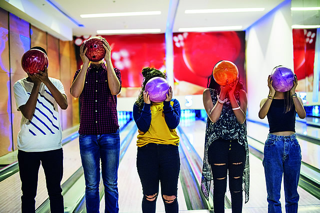 Young people bowling